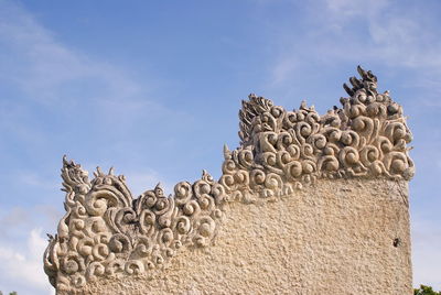 Statue of temple against sky