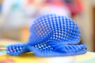 Close-up of blue shoes on table