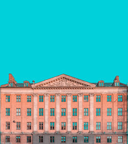 Low angle view of building against blue sky