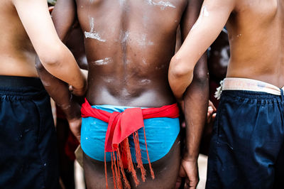 Rear view of shirtless woman