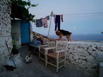Clothes drying on clothesline against sky