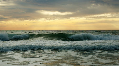 Beautiful sunset on the beach. the surf pounds the shore. phuket, thailand