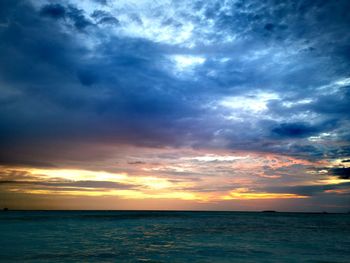 Scenic view of sea against dramatic sky