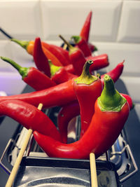 Close-up of red chili peppers at home