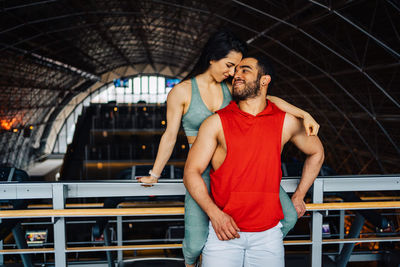 Portrait of young couple in love having a special moment in gym clothes
