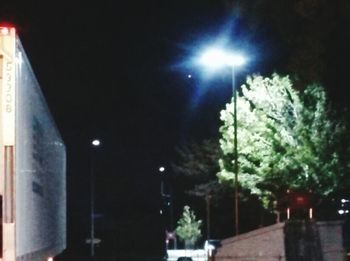 Low angle view of illuminated street light at night