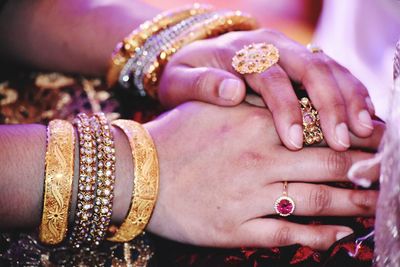 Close-up of hands holding flowers