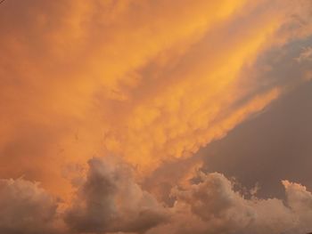 Low angle view of dramatic sky during sunset