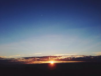 Scenic view of landscape against sky at sunset