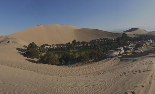 Scenic view of desert against clear sky