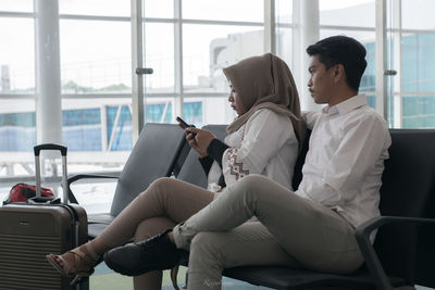 People sitting on chair at home