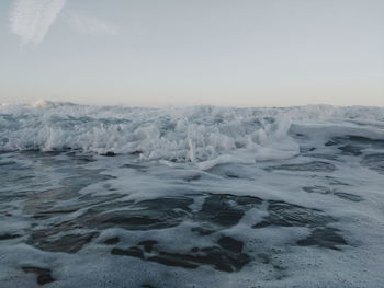 Scenic view of sea against sky during winter