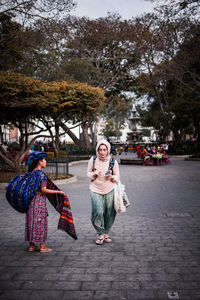 Women walking on street in city