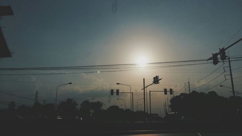 Low angle view of electricity pylon against sky