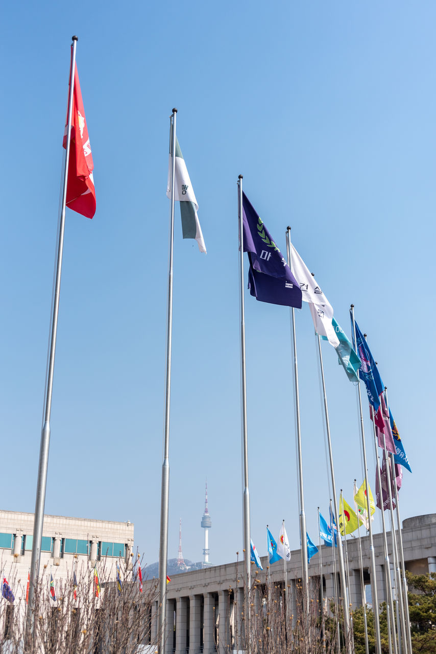 flag, patriotism, sky, nature, day, environment, architecture, clear sky, pole, blue, wind, no people, sunny, outdoors, built structure, low angle view, travel destinations