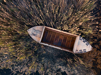 High angle view of abandoned car on field