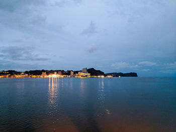 Scenic view of sea against sky at dusk