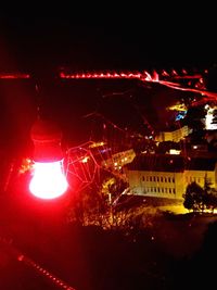 Close-up of illuminated red lights at night