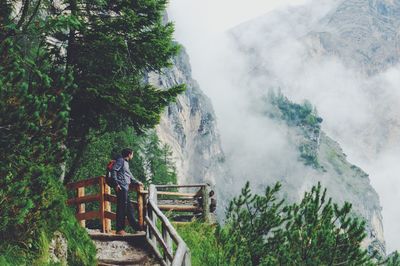 Man on mountain against sky