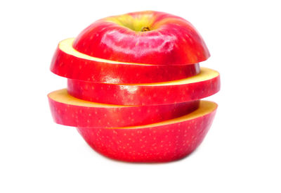 Close-up of red apple against white background