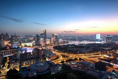 Aerial view of illuminated city at night