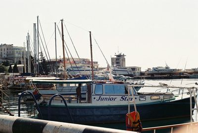 Boats moored at harbor