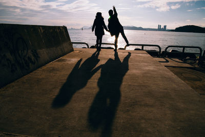 Shadow of men on beach