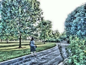 Full length of woman standing on grass