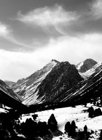 View of snowcapped mountain against cloudy sky