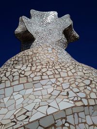 Low angle view of building against blue sky