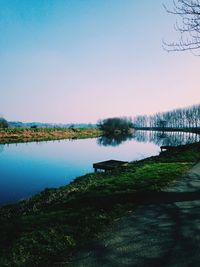 Scenic view of calm lake against clear sky