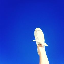 Low angle view of tree against clear blue sky