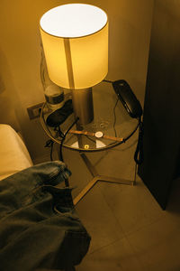 High angle view of illuminated electric lamp on floor at home