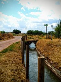 Scenic view of canal against sky