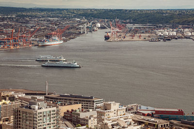 Ariel view of two ferries with clouds and blue sky by sea