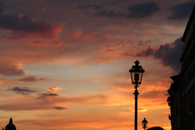 Low angle view of street light against sky during sunset