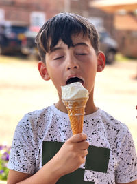 Midsection of boy holding ice cream