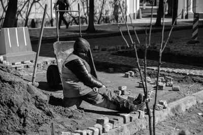 Man sitting on floor. tired worker