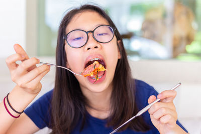 Portrait of woman eating food