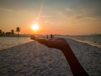 Scenic view of beach against sky during sunset