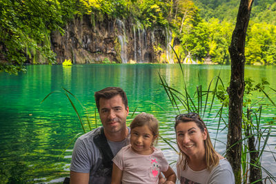 Portrait of a smiling young couple in water