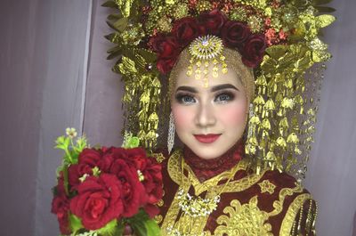 Portrait of woman with red roses