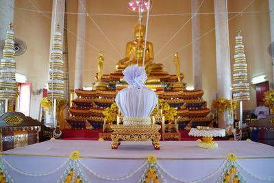 Statue in temple against building