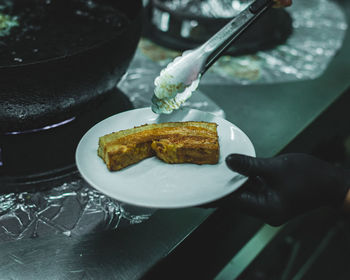 High angle view of person preparing food in plate