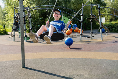 Boy playing soccer at park