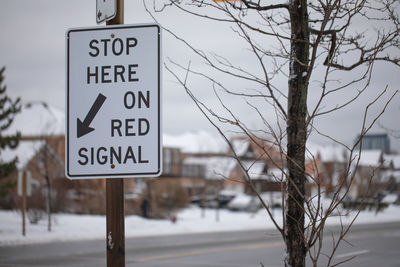 Information sign on road during winter