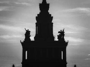 Low angle view of statue against cloudy sky