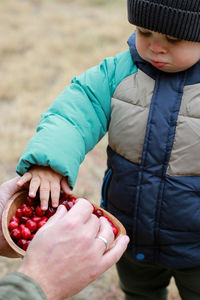 Midsection of man holding food