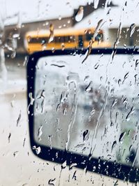 Close-up of wet car window in rainy season