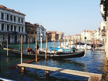 Boats moored in city